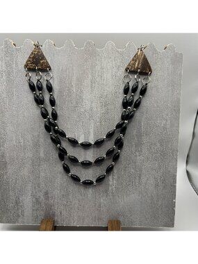 Three-Strand Black Bead Necklace With Coconut Shell Accents